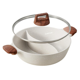CAROTE hot pot with divider and glass lid for dual-flavor meals on any stove.