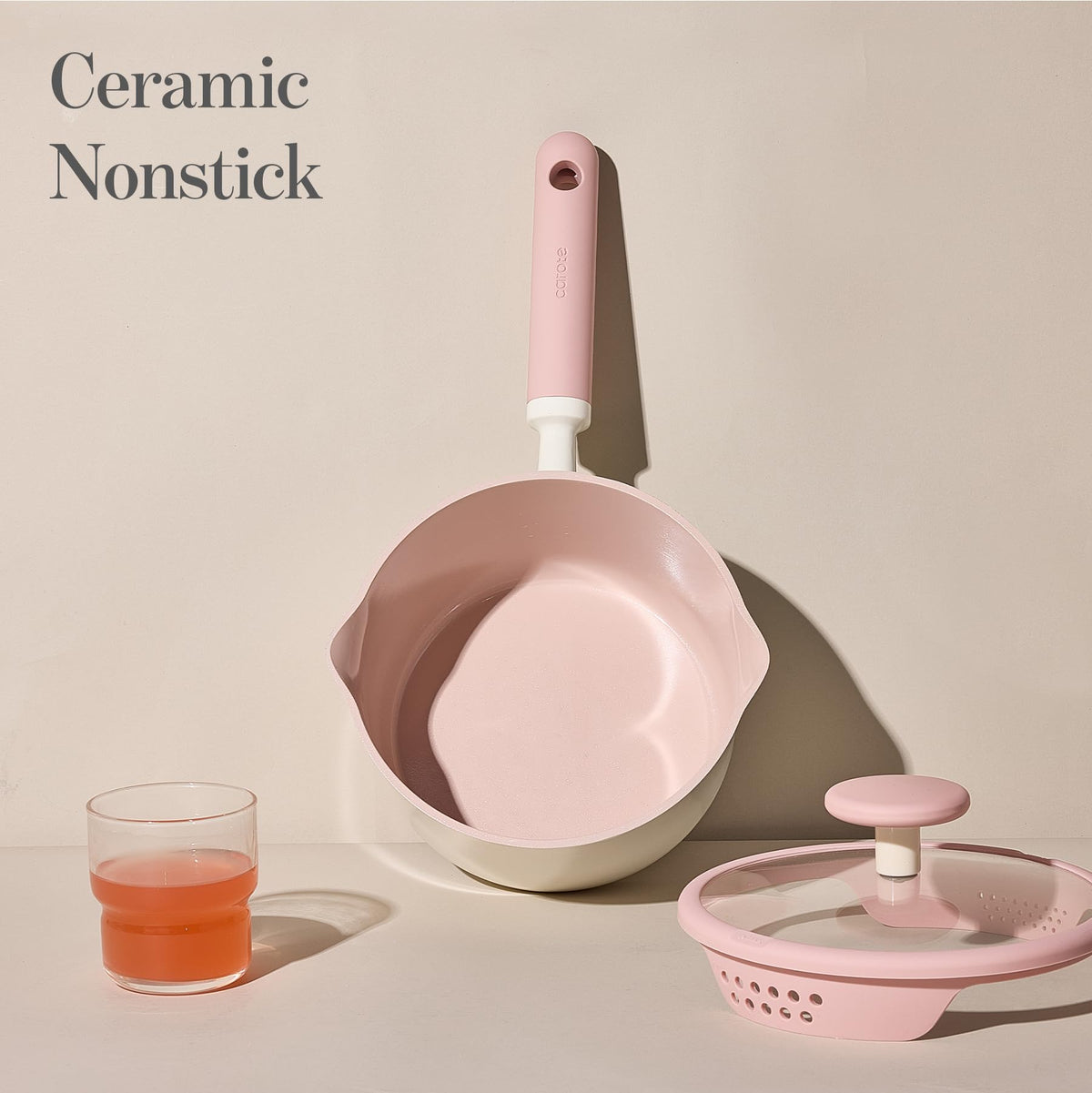 Enlarged base on CAROTE saucepan promoting even heat on multiple stoves.