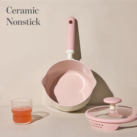 Enlarged base on CAROTE saucepan promoting even heat on multiple stoves.