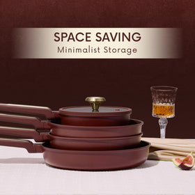 CAROTE wine red cookware on display adds a vibrant kitchen accent and style