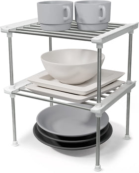 Carrotez cabinet organizer stackable set on counter maximizing plate and cup storage.