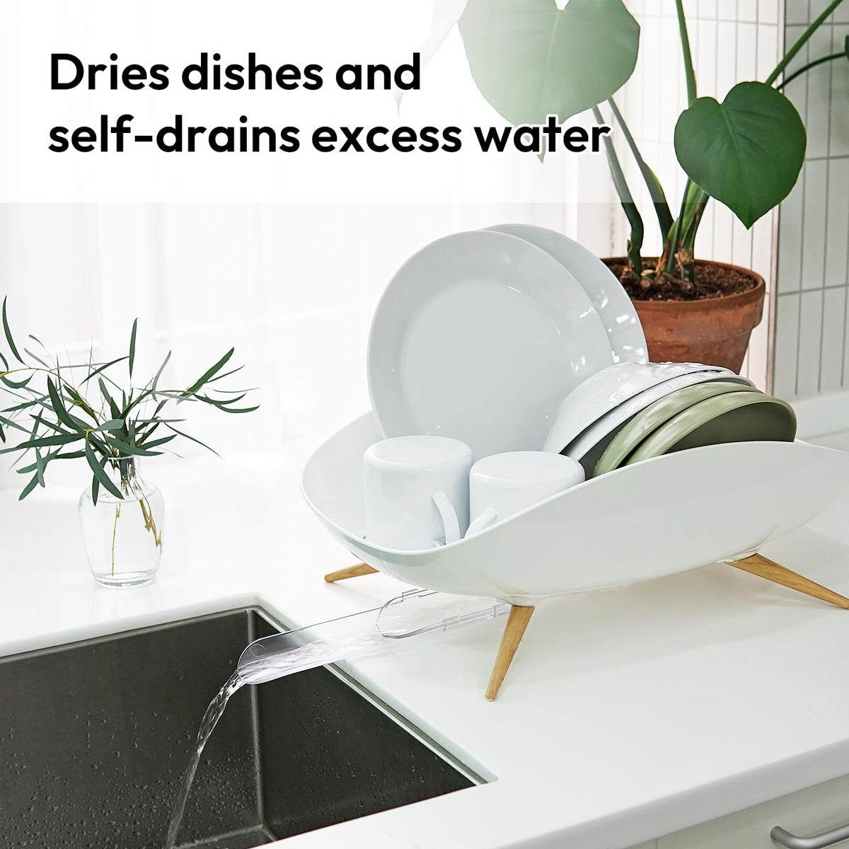 Carrotez dish drying rack swivel spout in action directs water into sink