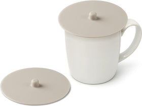 Carrotez ivory silicone cup covers in a 2-pack fit standard mugs for a dust-free seal.