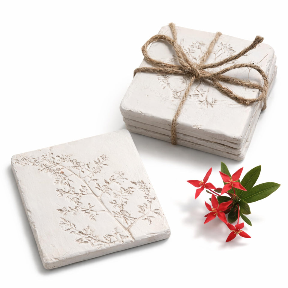 Cassbec ceramic coaster with white flower engraving protects surfaces while elevating decor.
