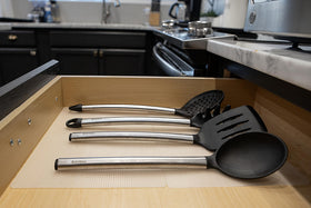 CatTongue Grips table top mat guards surfaces on shelves and workstations.