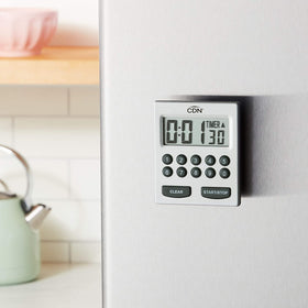CDN Direct Entry 2-Alarm timer hanging from a hook for space-saving use.