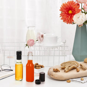 Cedilis clear glass bottle ideal for hot sauces, liqueurs, and dressings