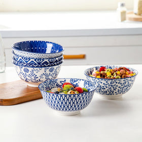 Cerkik stackable porcelain bowls maximize cabinet space and elegance.