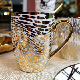 Certified International Matrix Gold mug showing one of six unique gold designs on white porcelain.
