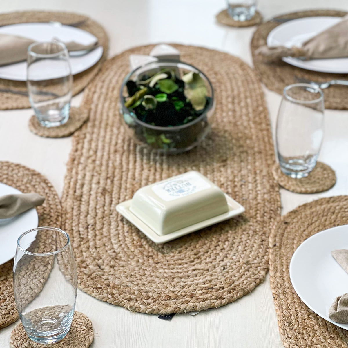 Chardin home jute braided oval table runner on dining setup enhances warm ambiance