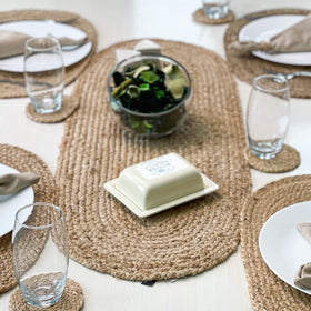 Chardin home jute braided oval table runner on dining setup enhances warm ambiance