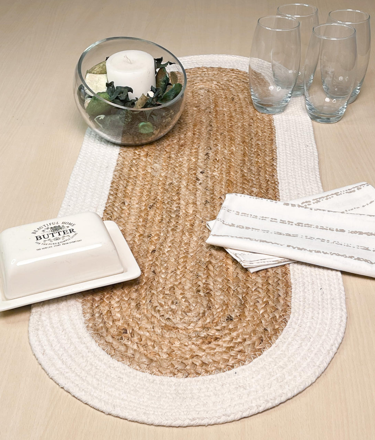 Chardin Home Verona runner with natural border detail adds soft contrast to table setting.
