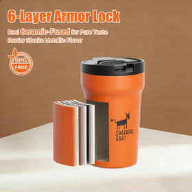 Compact travel mug beside a laptop, ready for on-the-go coffee