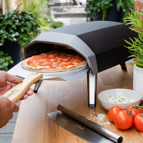 Chef Pomodoro pine handle stays cool up to 500°F for safe handling.