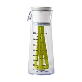 Chef'n Emulstir dressing mixer pouring with a drip-free flow for clean serving.