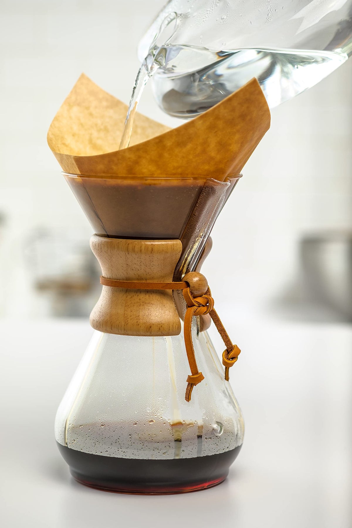 Bonded filters compatible with Chemex models shown in use.