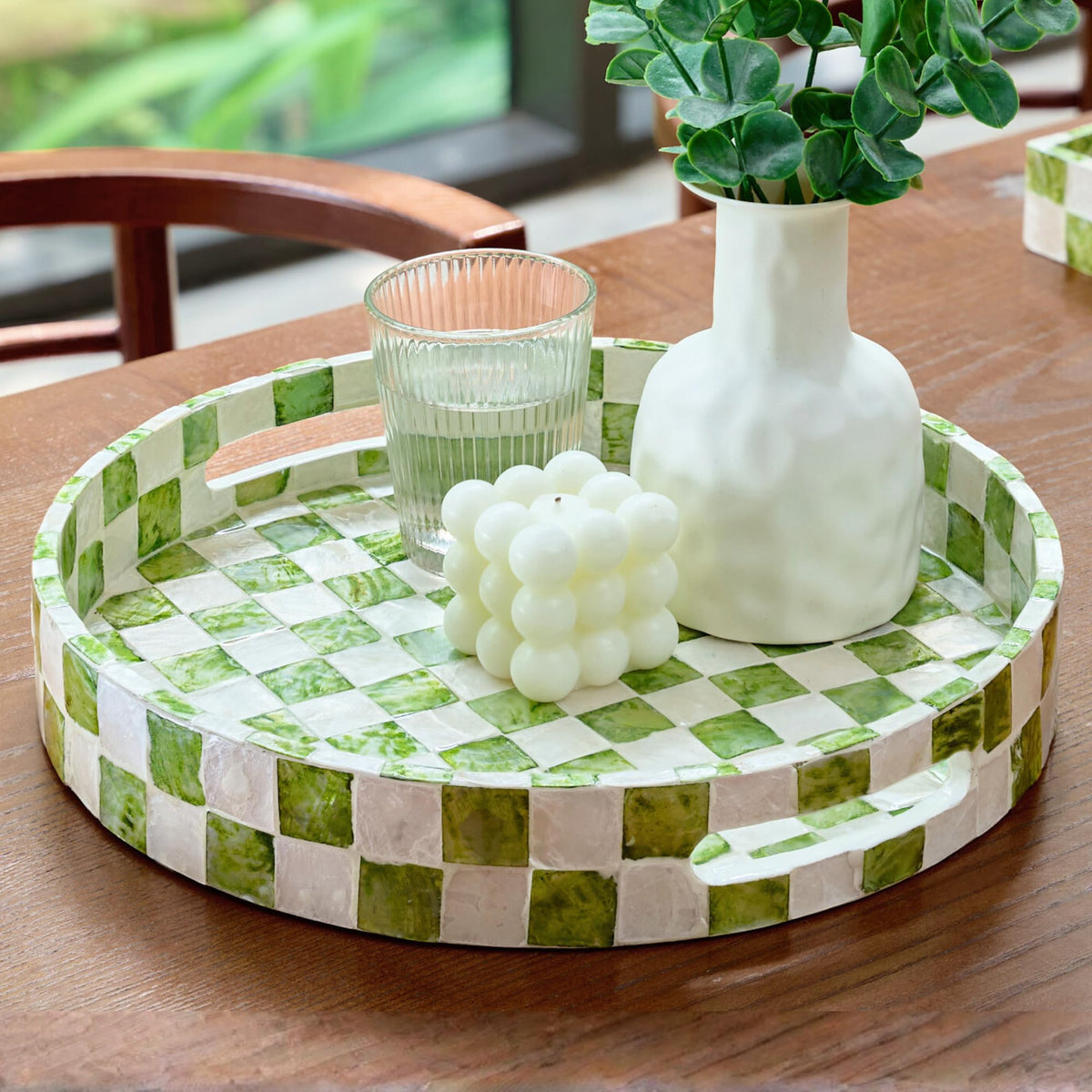 Chi An Home 12.6-inch round tray with checkered capiz for elegant table styling