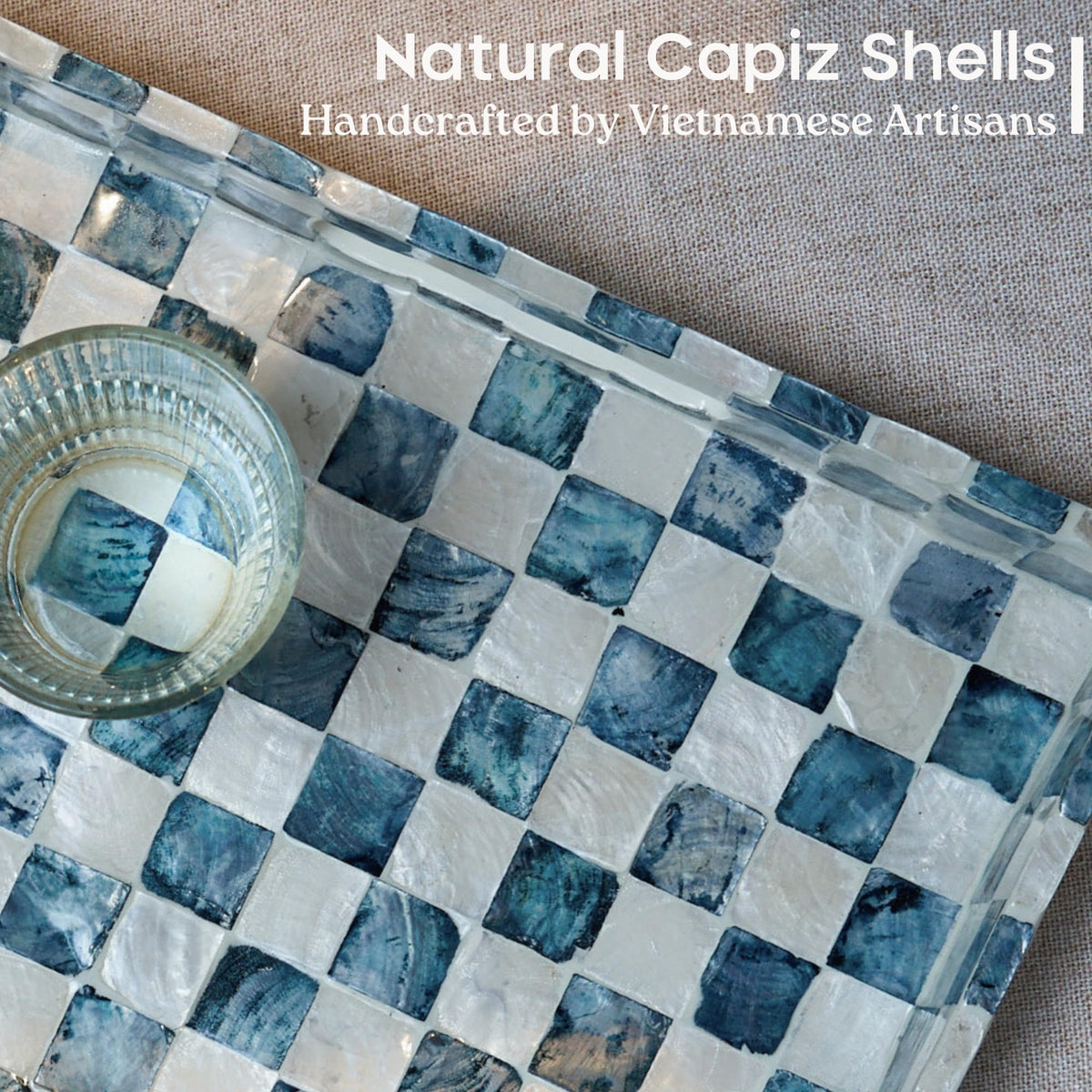 Chi An Home checkered capiz tray highlights natural shells and practical surface.