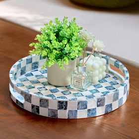 Chi An Home checkered capiz round tray with handles on a coffee table