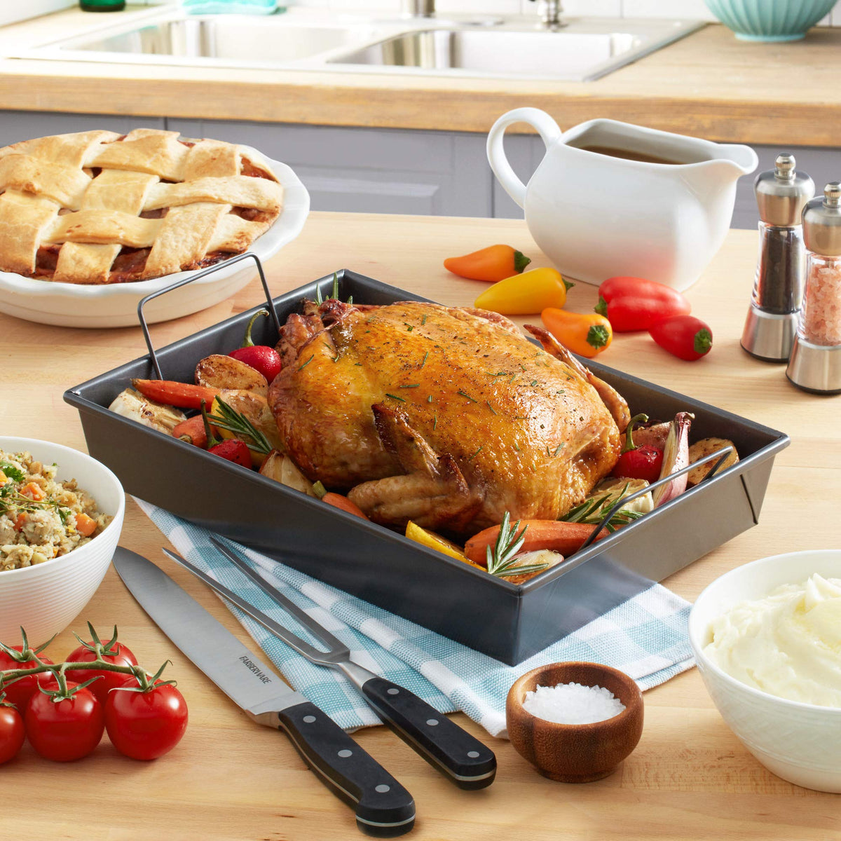 Chicago Metallic roast pan with rack handles for simple transfer of roasts.