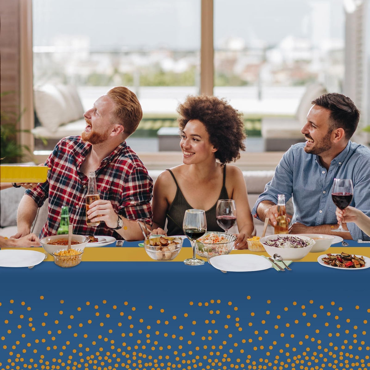 Childom party setup with blue-gold tablecloth enhances festive ambiance.