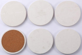 Chiseled ST DF SK limestone coasters for daily use and entertaining.
