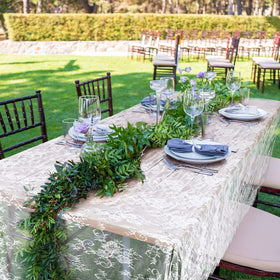 Chumia wedding reception decor lace tablecloth creating a romantic dining ambiance.