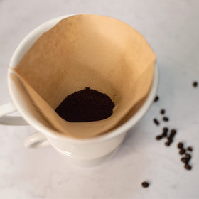 Cilio pour-over setup enables precise coffee extraction into mug or server.
