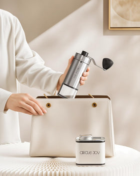 Circle Joy Mini Grinder in use on a travel setup for fresh grounds.