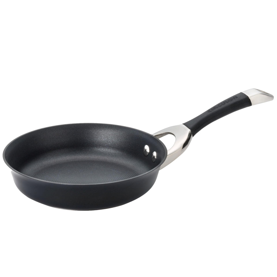 Circulon Symmetry hard anodized frypan coating close-up shows durable nonstick surface for easy release.
