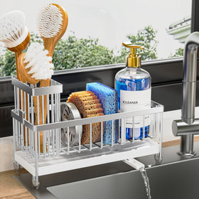 Cisily sponge holder with rotatable spout directs water into the sink for a cleaner countertop.