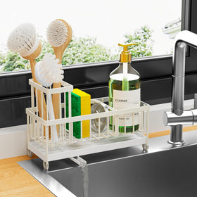 Cisily sponge holder with rotatable spout directs water to sink, keeping counter dry