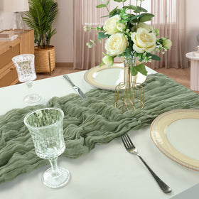 CKIKU holiday banquet setup using sage-green cheesecloth runner