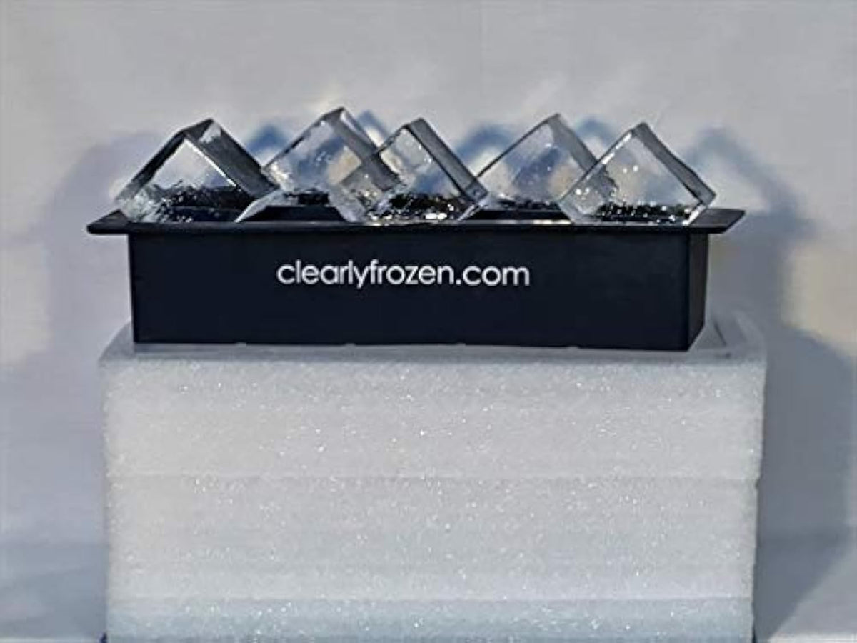 ClearlyFrozen ten-cubes ice tray releasing large glass-like ice cubes.