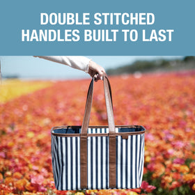 CleverMade Collapsible Luxe Tote navy striped travel-ready tote for trips and laundry.