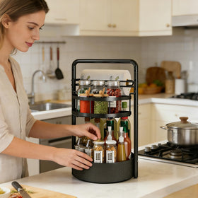 CLOKTA Rotating Spice Rack with built-in paper towel holder for quick cleanup.