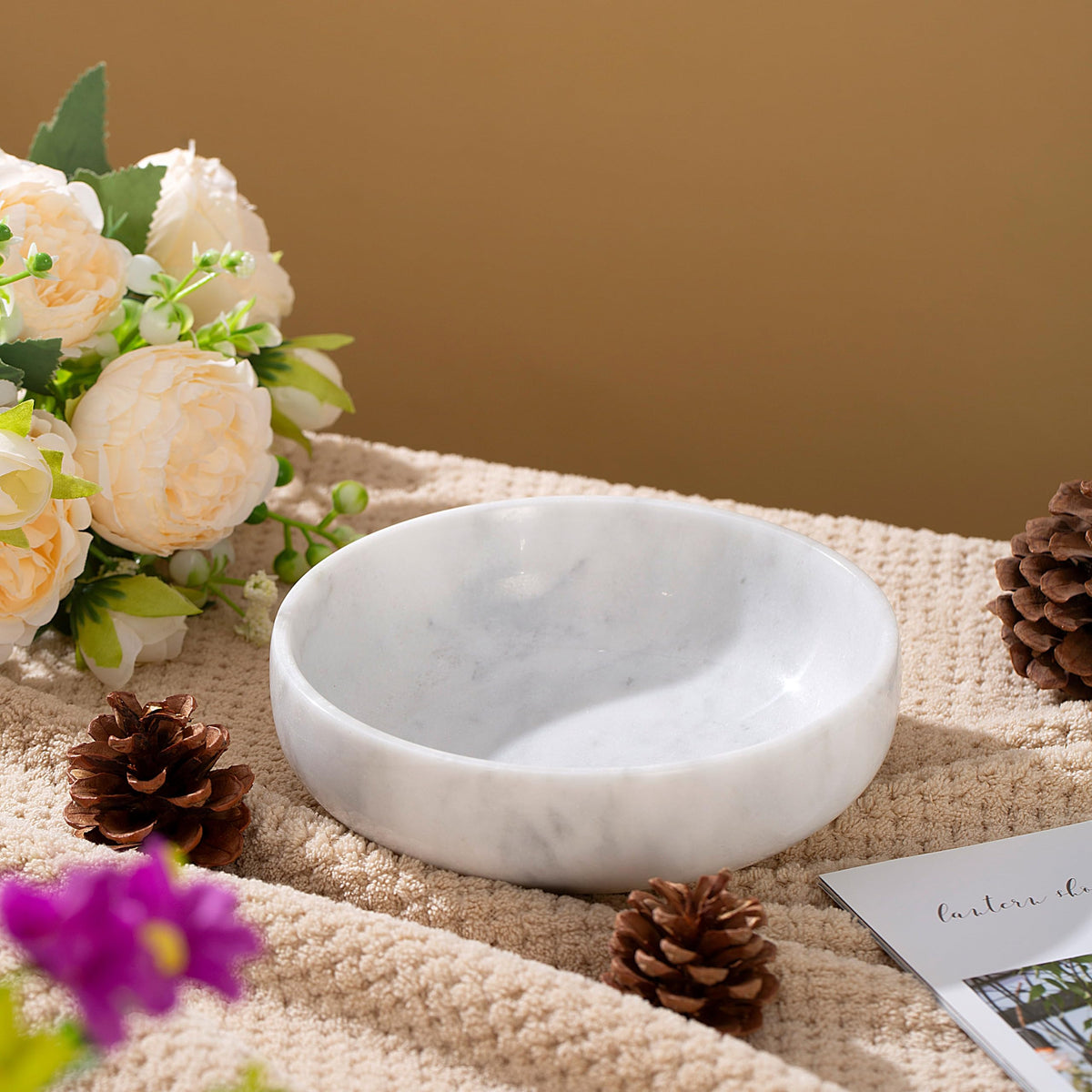 CM CHIC MONDAY marble dish filled with nuts for guests.