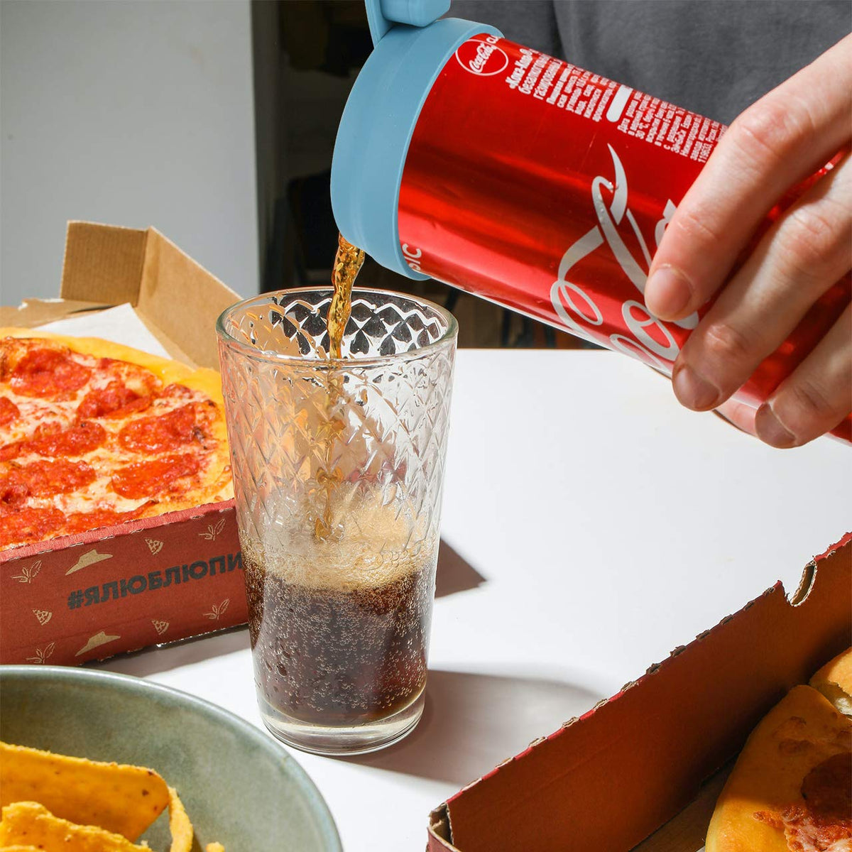 Dark blue CM lid keeps beverages fresh during outdoor use.