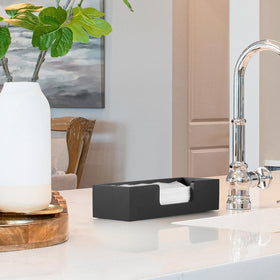 CMLKLZD paper towel dispenser doubles as storage for small bathroom accessories.