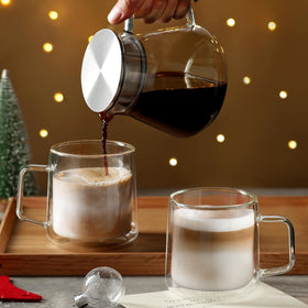 CNGLASS mug in use for a latte, showcasing transparent glass.