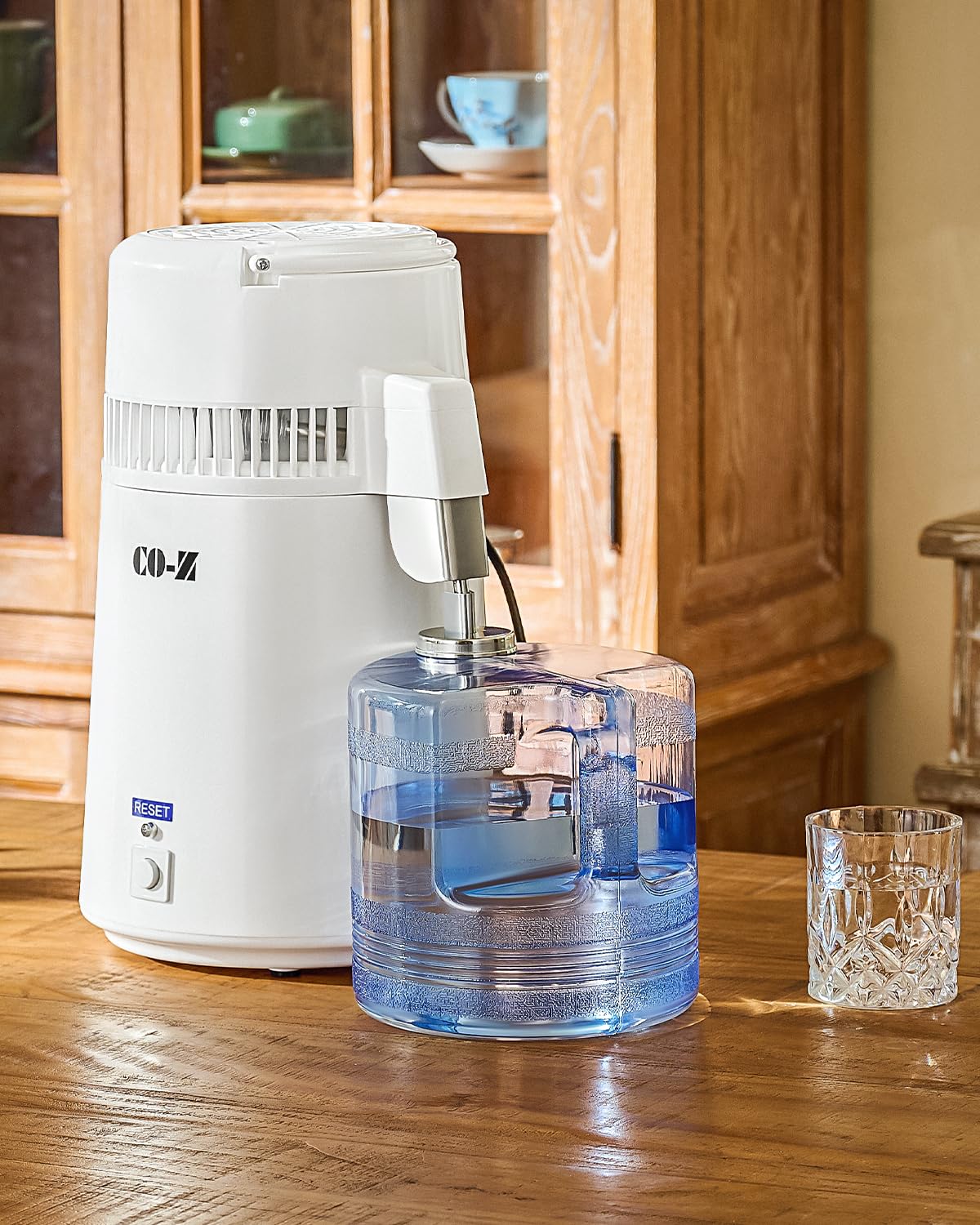 CO-Z water distiller with portable handle for easy moving and storage.