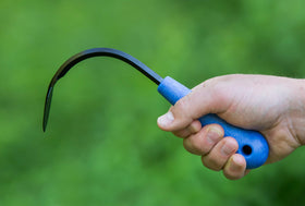 CobraHead mini weeder in hand showing versatile garden tool use.