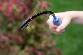 CobraHead mini weeder recycled-plastic-handle ergonomic grip in hand.