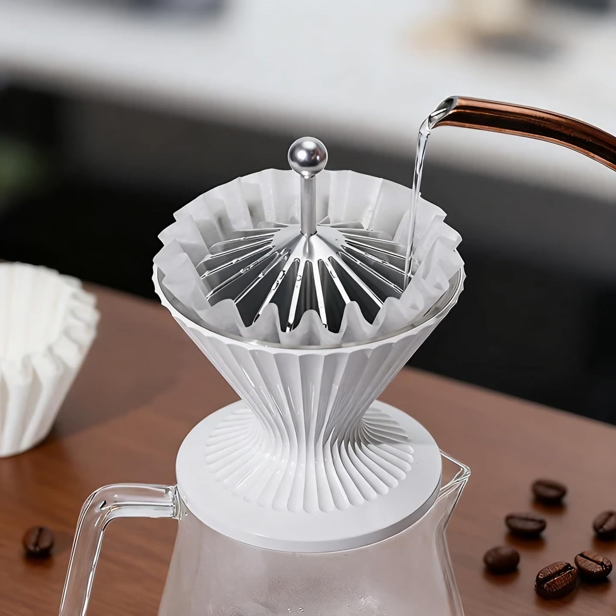 Smooth-handle Codale presser protects dripper and hands during use