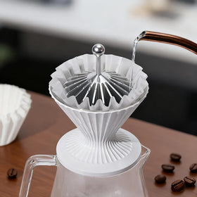 Smooth-handle Codale presser protects dripper and hands during use