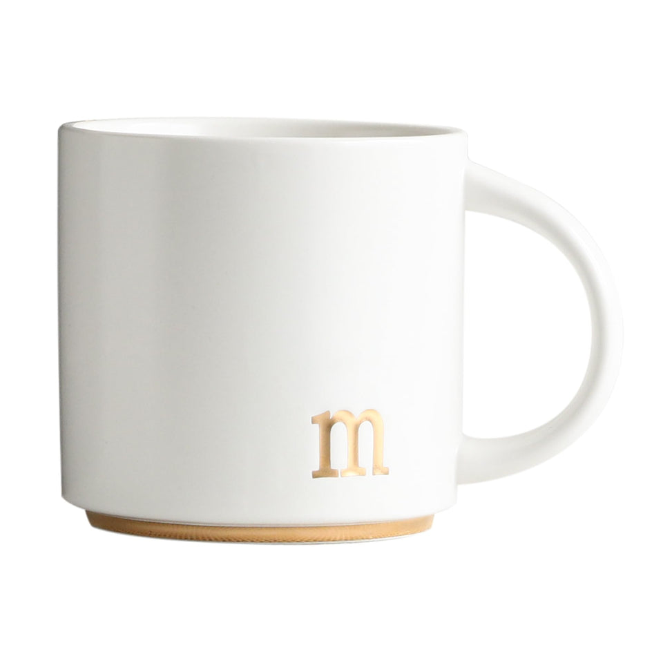 COLLECTIVE HOME monogram mug gold initial closeup highlighting luxury detail