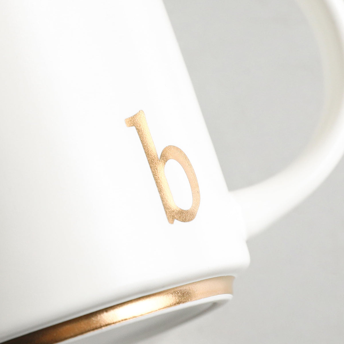 COLLECTIVE HOME monogram mug on a desk setting for an elegant workspace