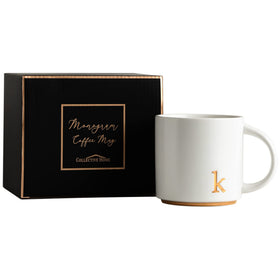 COLLECTIVE HOME mug on office desk for stylish coffee or tea breaks.