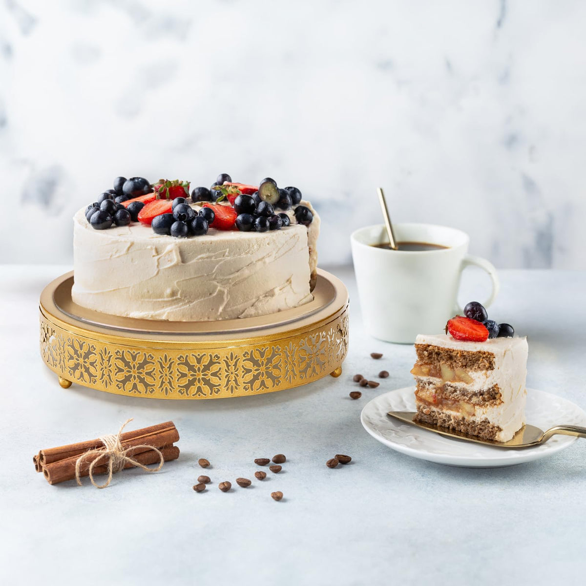 Coloch golden cake stand on a wedding table elevates pastries and florals.