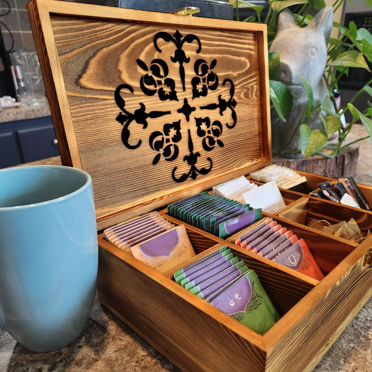 Coloch storage box featuring a golden buckle and carved lid